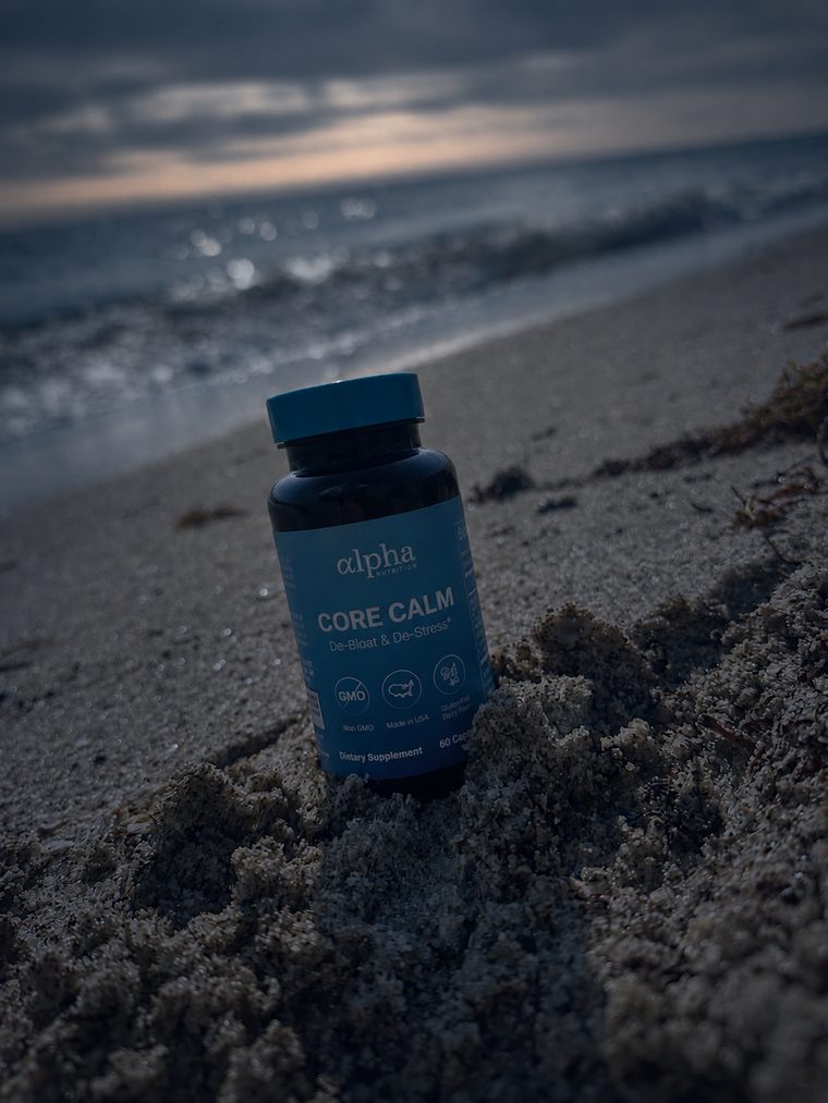 Core Calm bottle on the sand at dusk